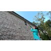 Woman gutter cleaning P2 AC